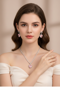 Model wearing complete pink heart jewelry set